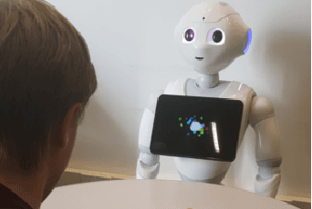 Figure 1 for A Robot's Expressive Language Affects Human Strategy and Perceptions in a Competitive Game